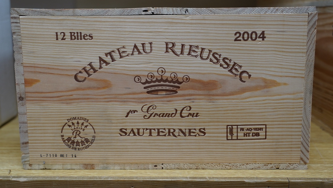 A sealed case of twelve bottles of 2004 Chateau Rieussec, Sauternes, in OWC, purchased en primeur from The Wine Society. Condition - good